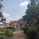 Kigali Good big plot with house for sale in Gisozi on main road 